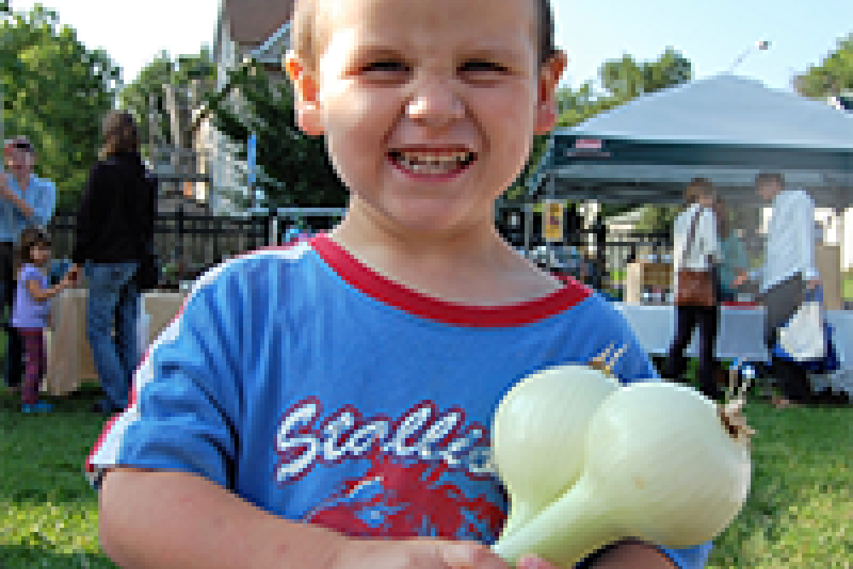 small boy with onion