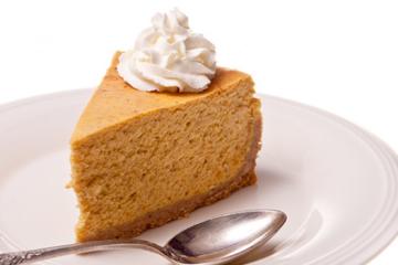 sweet potato cheesecake slice with whipped cream on top