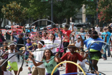 hotograph of children from START performing at Cesar Chavez Park in Sacramento, California in 2014