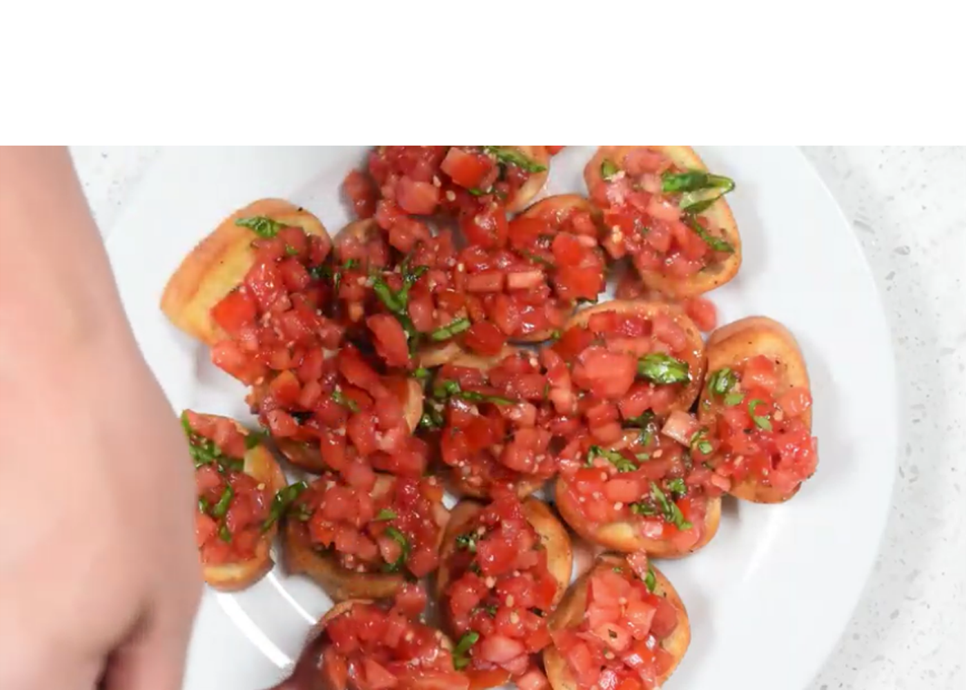chopped tomatoes and basil on small slices of bread
