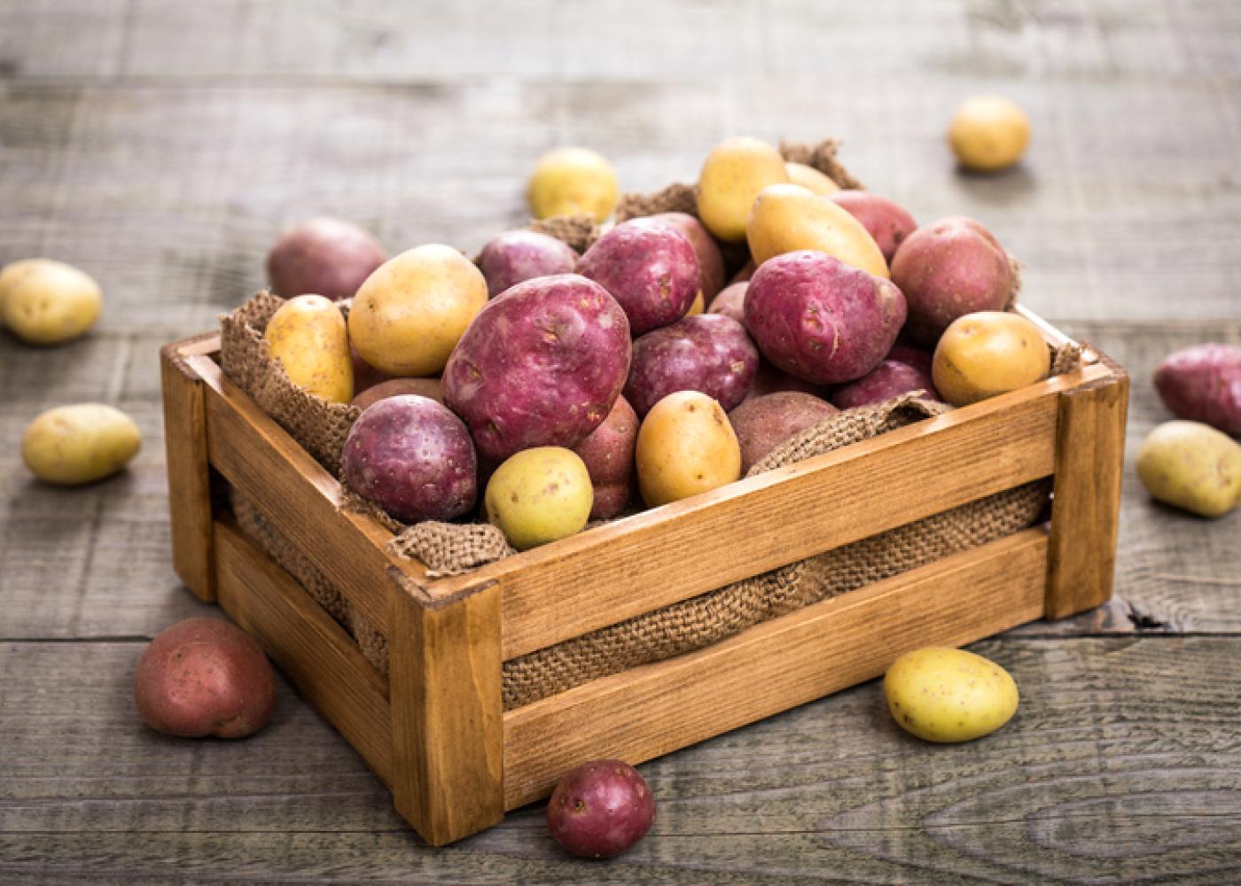 Red and white potatoes in a crate