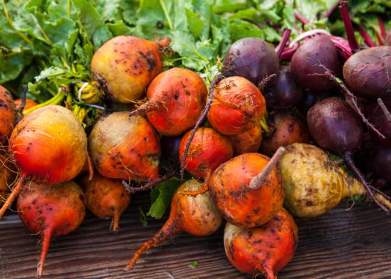 red and purple beets with green tops