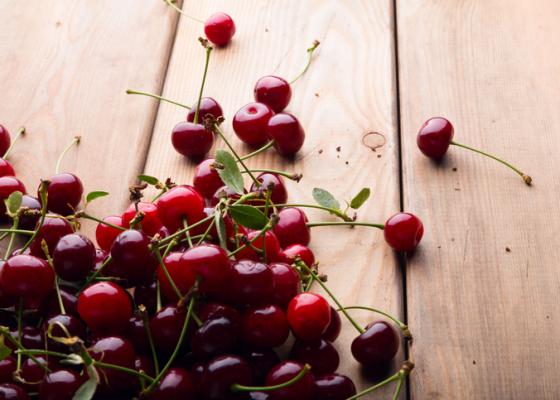 a bunch of cherries on a table