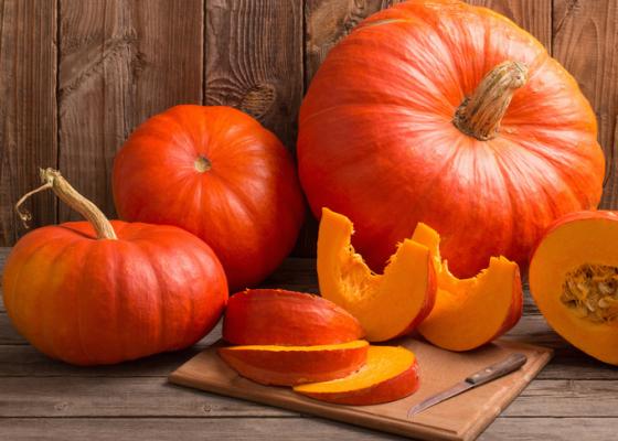whole and sliced pumpkins