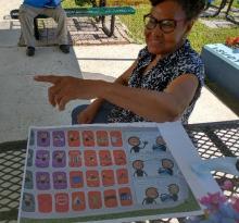 snap-ed educator assists with the garden